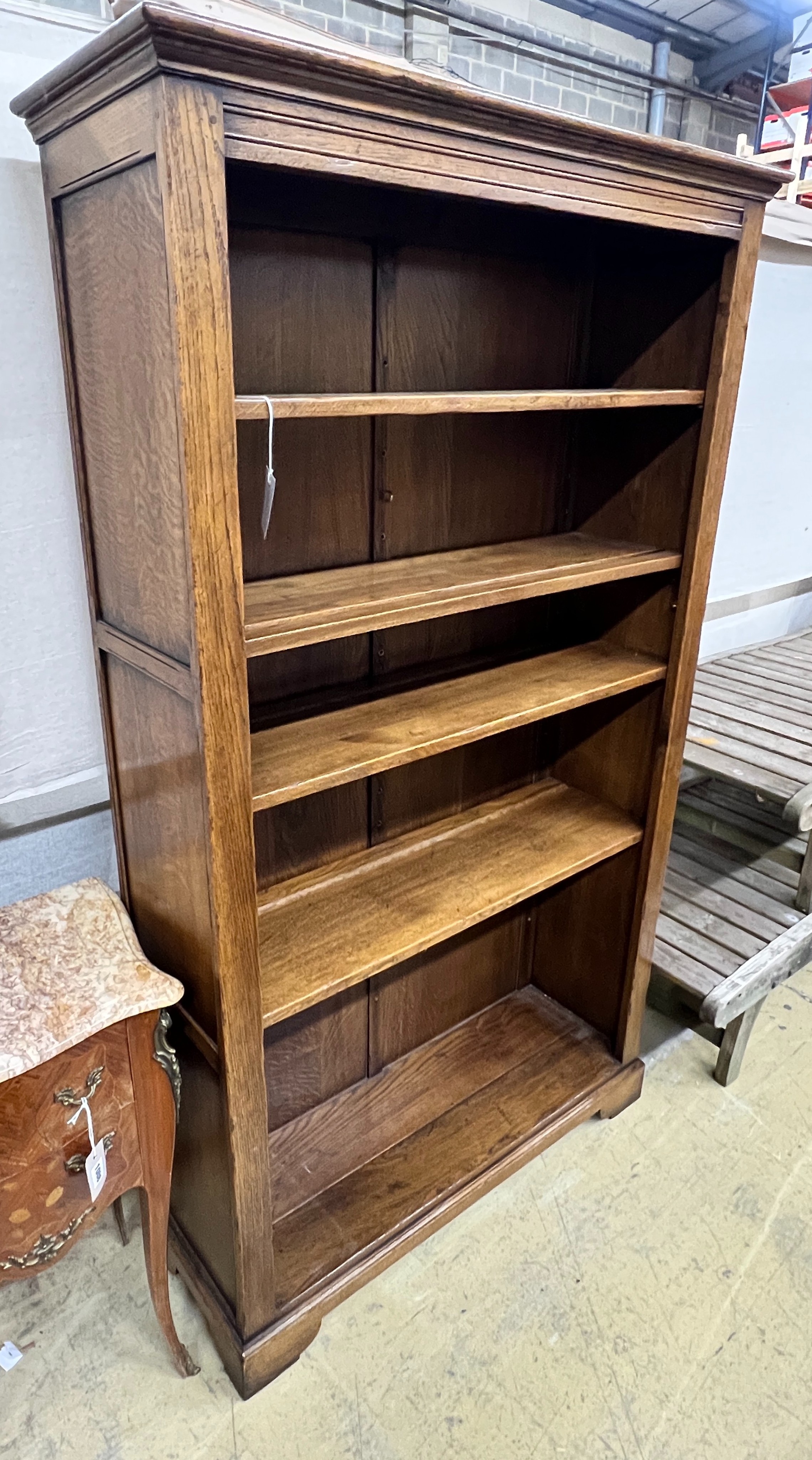 A reproduction oak open bookcase, width 100cm, depth 33cm, height 170cm